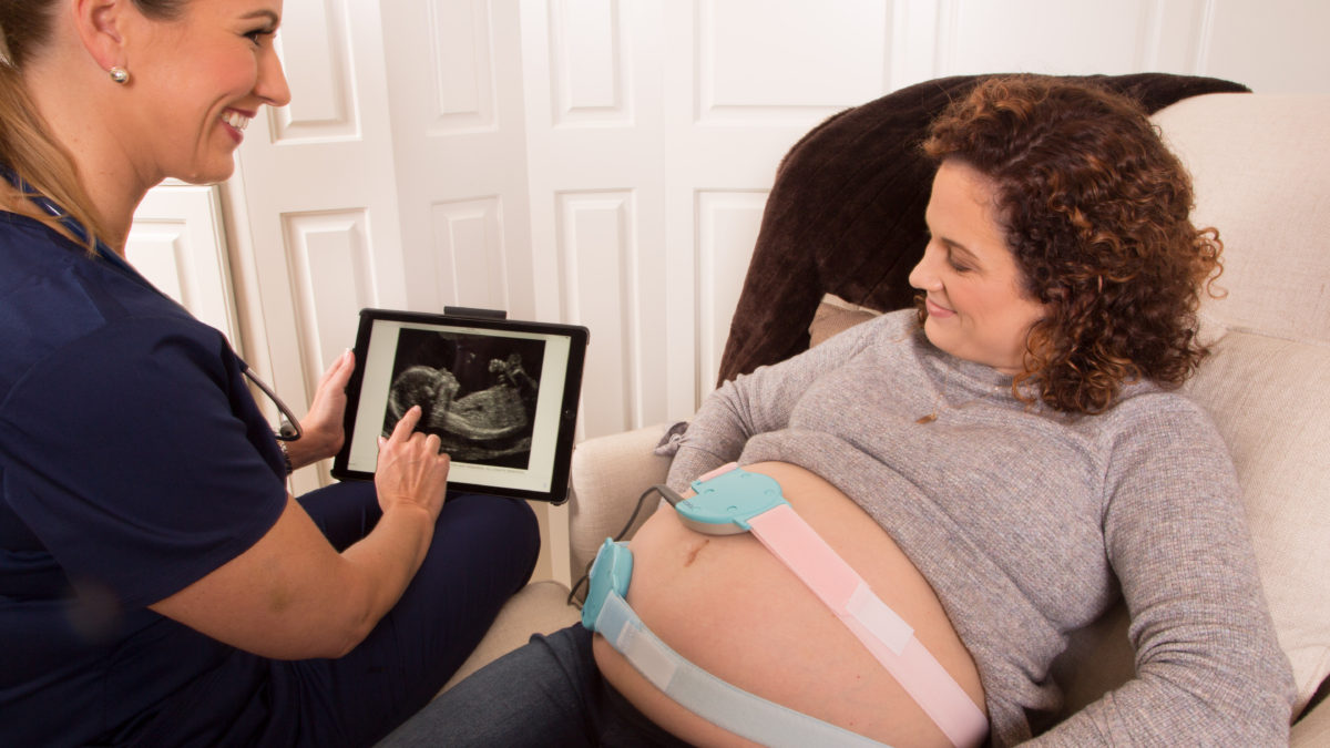 OB-GYN showing her patient's child