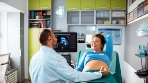 Woman Getting Checked By an OBGYN