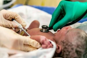 Newborn Getting Checked