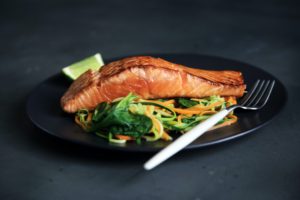 Delicious plate of baked salmon and zucchini noodles