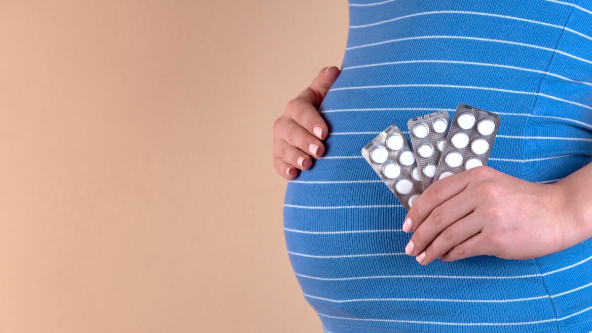 Pregnant woman taking medication