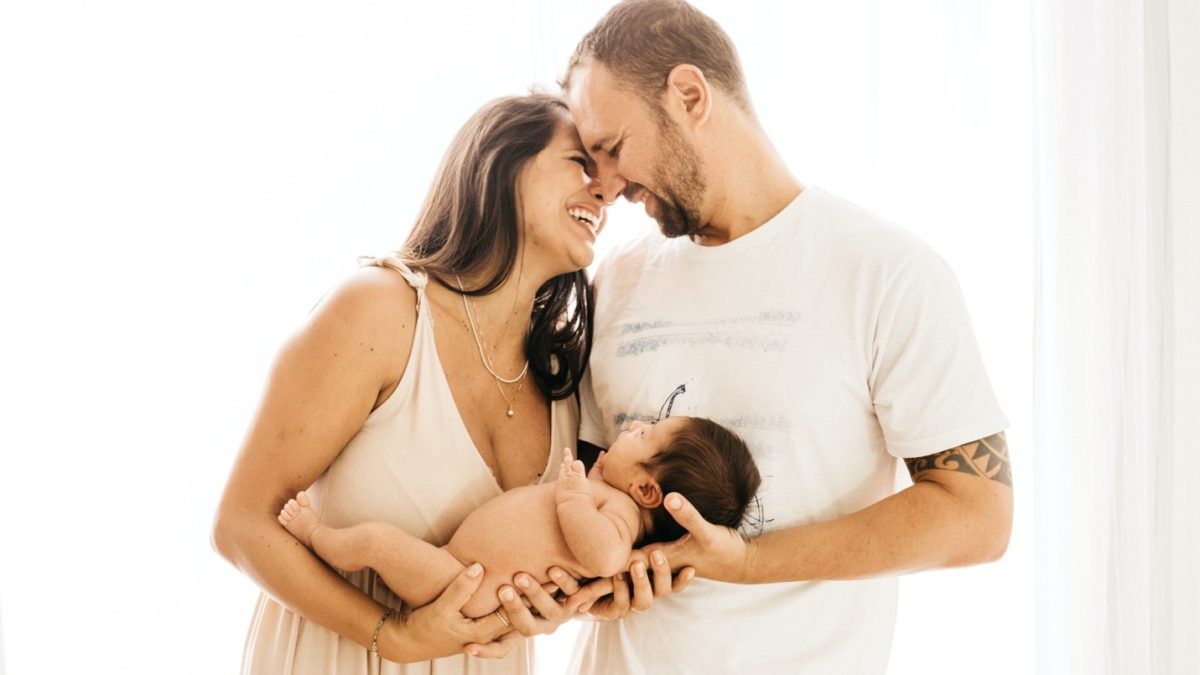 Happy couple with their new baby