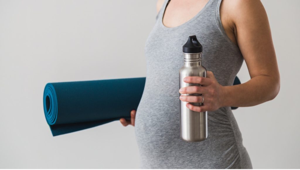 Mother in her second trimester preparing for yoga