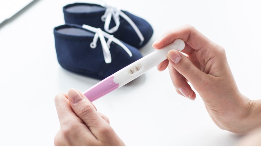 Woman Looking at Pregnancy Test