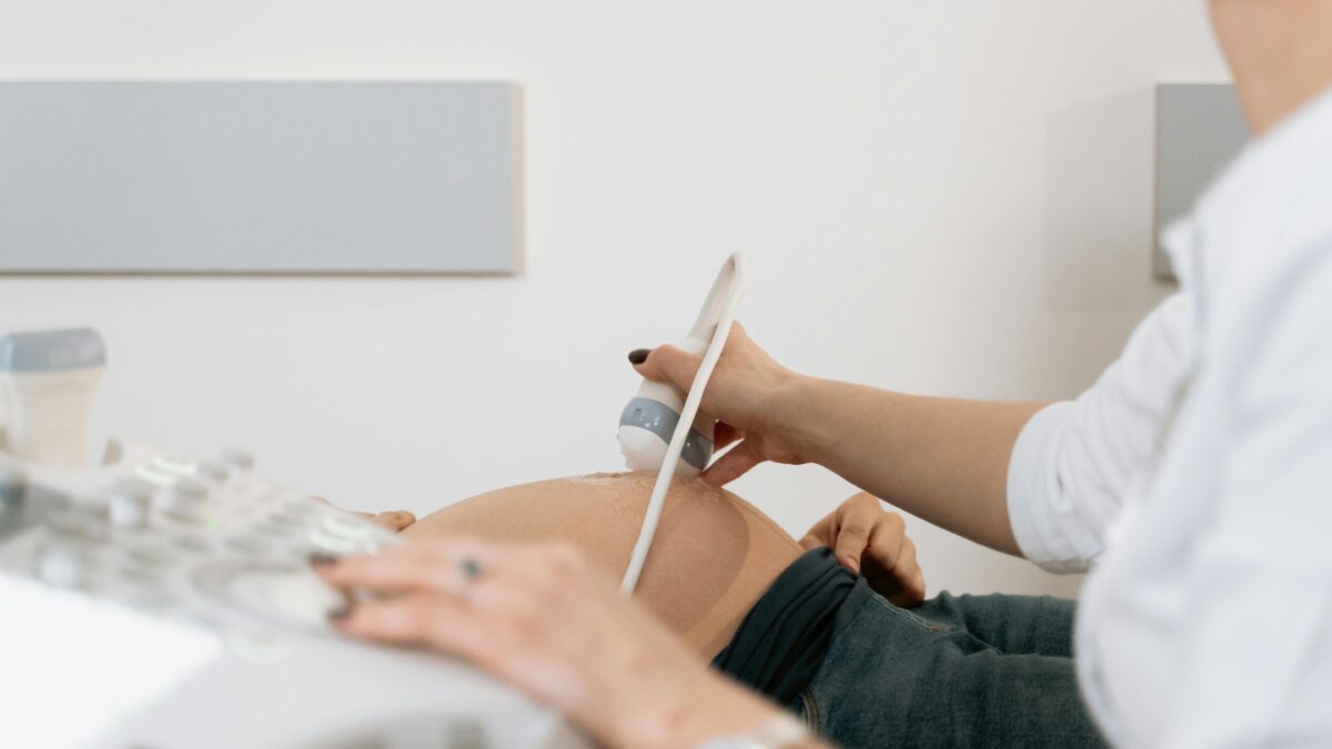 a doctor performing a pregnancy ultrasound