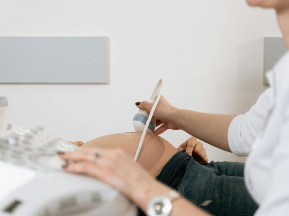 a doctor performing a pregnancy ultrasound