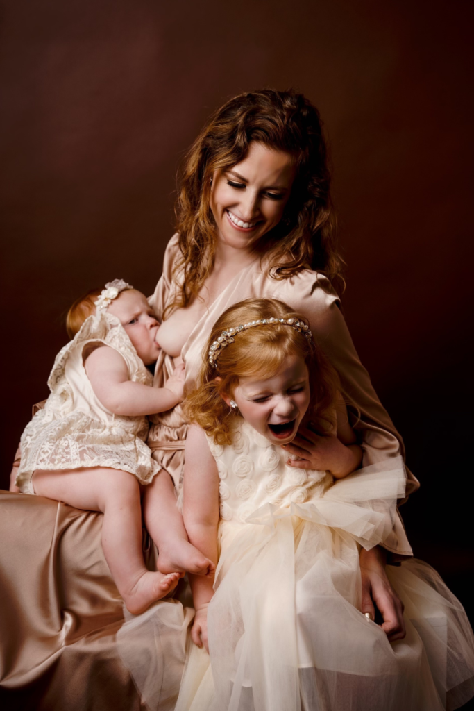 Mother and Two Daughters Smiling at the Camera